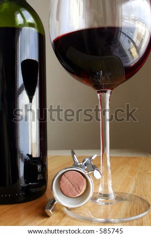 Wine bottle, glass and corkscrew