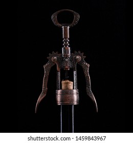 Wine Bottle Uncork. Closeup Vintage Bronze Corkscrew On Vine Bottle Neck. Low Key, Silhouette, Isolated On Dark Background. Place For Text. Copyspace.