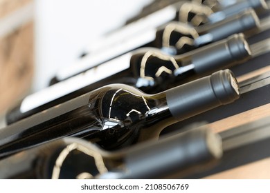 Wine Bottles With Blank Labels On The Counter Of A Liquor Store. Wine Background. Selected Focus