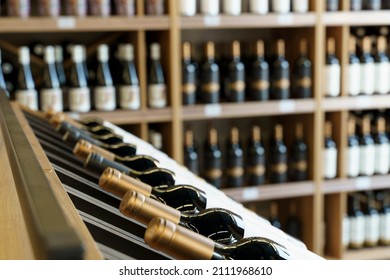 Wine bottles with blank labels on the counter of a liquor store. Wine background.