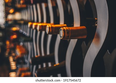 Wine Bottles In The Wine Cellar. Upscale Luxury Food And Beverage Concept Backdrop With Place For Text