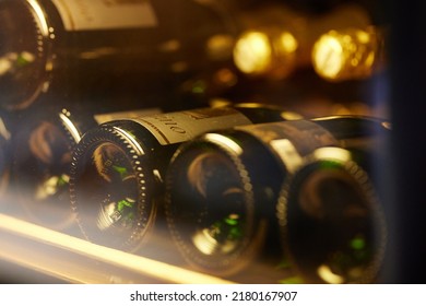 Wine bottles in a wine fridge