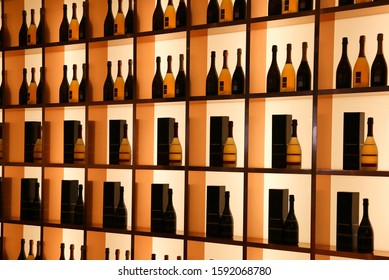 Wine Bottles On Shelfs In Wine Bar As Wall Decor