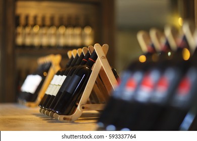 Wine Bottles On A Wooden Shelf. Wine Bar. 