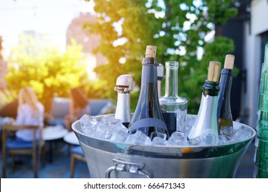 Wine Bottles Set In Bucket, NYC Rooftop