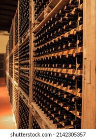 Wine Bottles Stacked In The Cellar Basement.