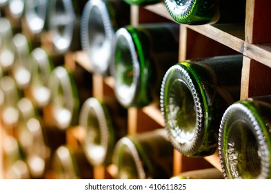 Wine Bottles Stacked On Wooden Racks