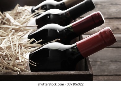 Wine bottles in wooden crate,  black and white retro stylization