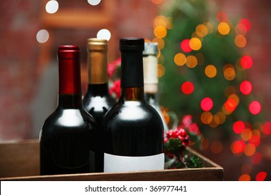 Wine In Box On Blurred Christmas Tree Background