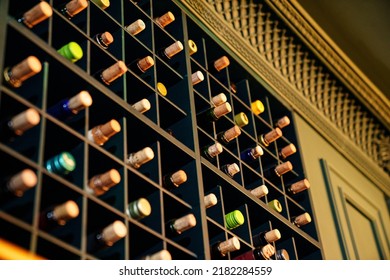 wine cabinet in the interior. alcohol storage in a restaurant or in the house. collection of wine and cognac.