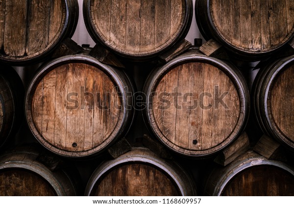 Wine casks at the winery. Stacked Wine barrels at\
the german winery.