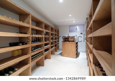 Wine cellar with bottles and cigar humidifier. Nobody inside