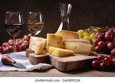 Wine, cheeses and grapes in a vintage setup. - Powered by Shutterstock