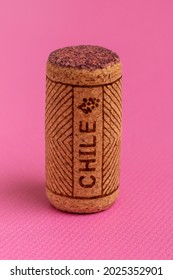 Wine Cork Close-up. On A Pink Background. Name Of Wine Country Chile Is Written On Cork.