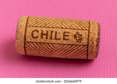 Wine Cork Close-up. On A Pink Background. Name Of Wine Country Chile Is Written On Cork.