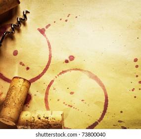 Wine Cork, Corkscrew And Red Wine Stains On The Vintage Paper Background
