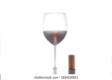 Wine Cork Stopper And Silhouette Of Red Wine Glass Isolated On White Background With Copy Space For Your Text