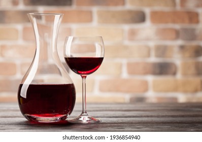 Wine decanter and glass of red wine. With copy space