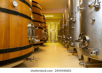 Wine fermentation tanks in modern wine factory - Powered by Shutterstock