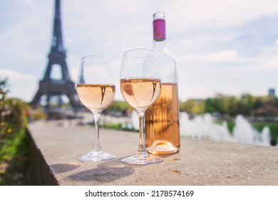 Wine in a glass near the eiffel tower. Selective focus. Nature.