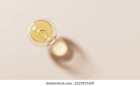 Wine glass on a bright background. The hard light creates sharp shadows, adding a dramatic effect to the scene, emphasizing the shapes - Powered by Shutterstock