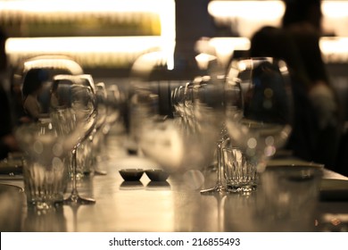 Wine Glasses Defocused In Bar And Restaurant And Blurred Background