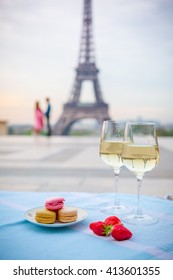 Wine Glasses And Eiffel Tower In Paris Spring
