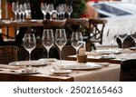 wine glasses on table in fancy restaurant by the sea