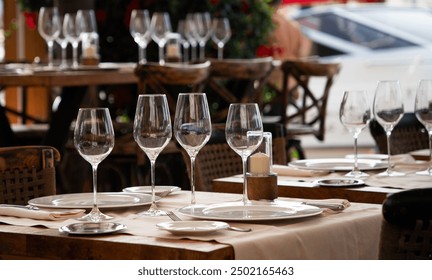 wine glasses on table in fancy restaurant by the sea - Powered by Shutterstock