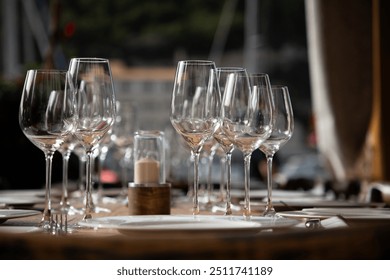 wine glasses on table in fancy restaurant by the sea - Powered by Shutterstock