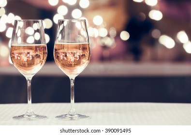 Wine glasses in a restaurant setting. 