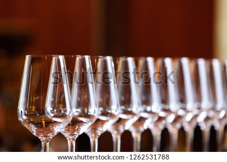 Wine glasses in a row. Buffet table celebration of wine tasting. Nightlife, celebration and entertainment concept. Horizontal