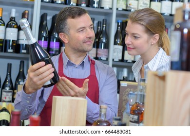 Wine Merchant Advising Customer