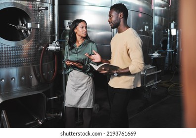 Wine Production Workers Using Alcohol Machine Or Distillery Equipment In Warehouse Winery. Business Sommelier Expert Woman And Man Talking And Working On Quality Control Maintenance With A Checklist