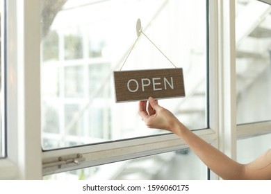 Wine Shop Owner Holding Open Sign