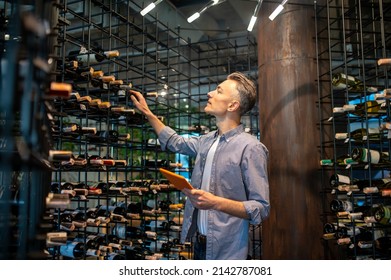 A Wine Store Owner Making A Revision And Looking Busy