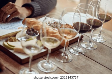 Wine tasting, cheese board and winery restaurant with alcohol and glass for customer. Eating, drink and person with rich wines and food pairing in a fine dining and luxury snack experience alone