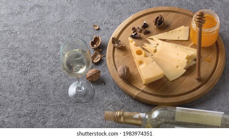 Wine tasting concept with traditional appetizers of cheese, nuts and honey