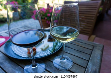 Wine Tasting In Italy, Cinque Terre. Two Glasses Of Italian Wine:red And White. Selective Focus.