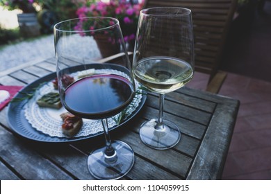 Wine Tasting In Italy, Cinque Terre. Glasses Of Red And White Italian Wine. Shallow Depth Of Field. 