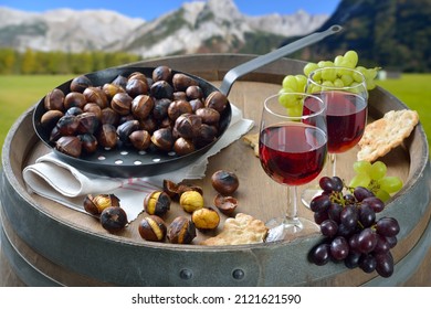 Wine tasting in Tyrol with roasted chestnuts and the local crunchy rye bread, so-called Schuettelbrot, served outside on an old wine barrel