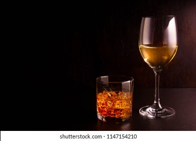 Wine And Whiskey On A Black Background.