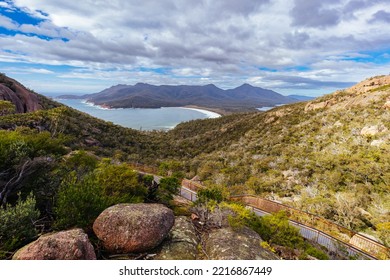 Wineglass Bay From The Lookout And Walkway On The Freycinet Peninsula Circuit Day Hike On A Warm Wet Spring Day In Freycinet National Park, Tasmania, Australia