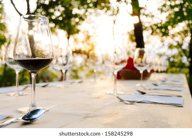wineglasses on prepared table outdoor