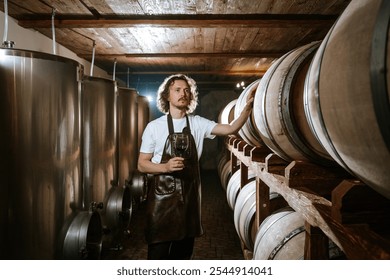 Winemaker Inspecting Red Wine in Cellar