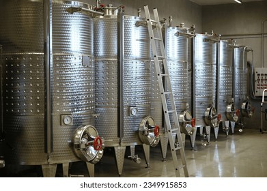 Winery producing wine. Wine fermentation tanks.
 - Powered by Shutterstock