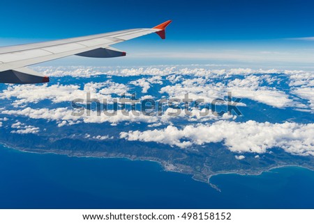 Wing of airplane and landscape