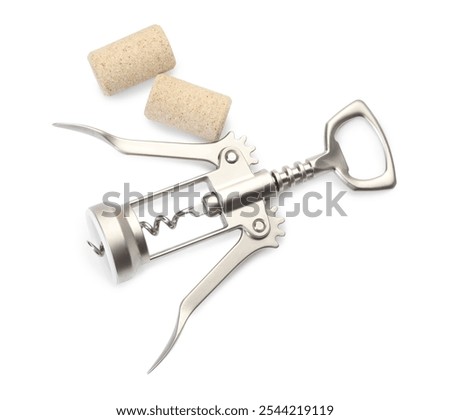 Wing corkscrew and corks isolated on white, top view