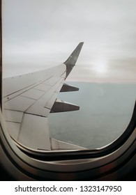 Wing of plane seen through window
