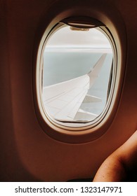 Wing of plane seen through window